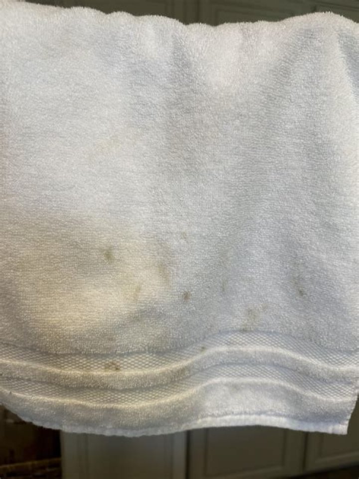 Why are my white towels getting brown spots?